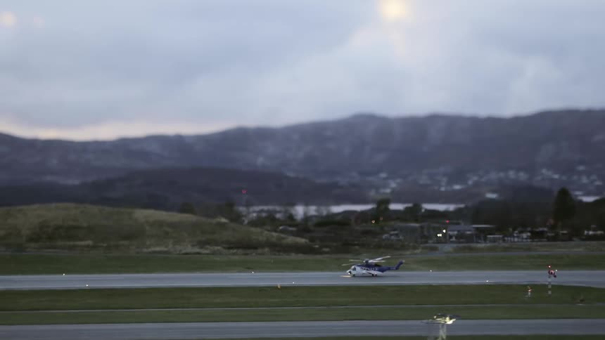 Tilt shift effect of a helicopter moving on a runway