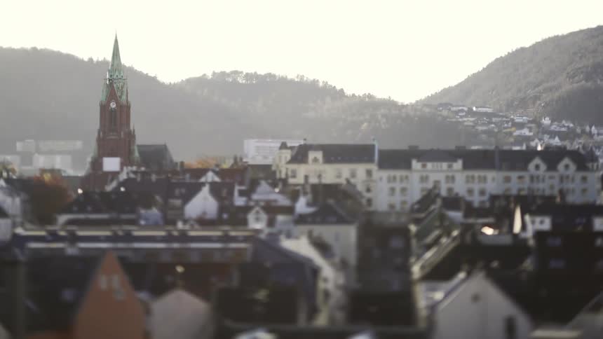 A view of some buildings in a large city on a sunny day