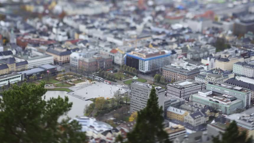 Panorama of a metropolis with buildings and a square with pedestrians in time lapse