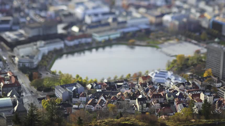 A lake surrounded by a bustling city