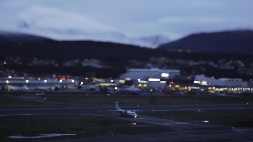 A plane taxis on an airport runway