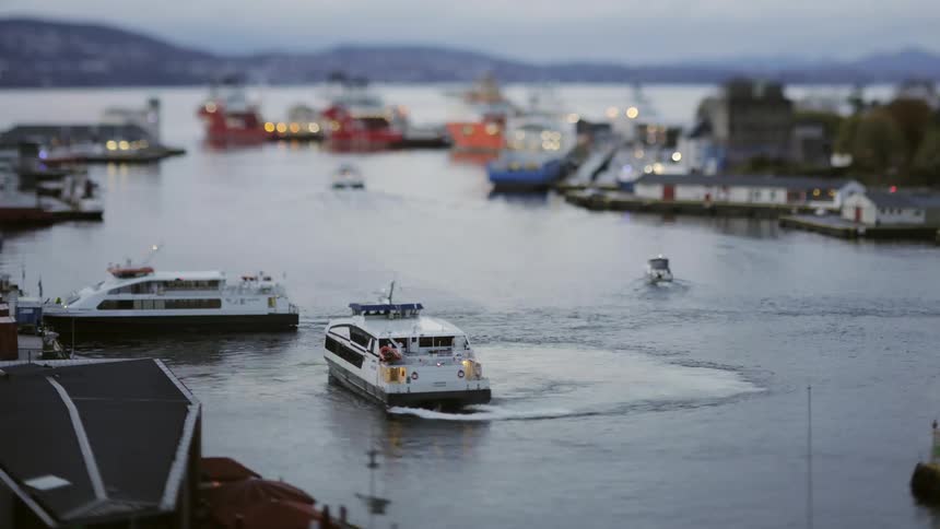 Tilt shift effect footage of harbor with various boats and ships