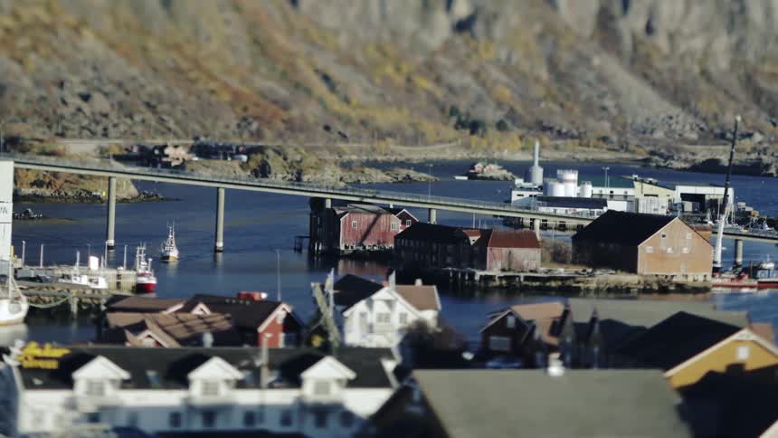 Panorama of an urban city by the sea with mountains around it
