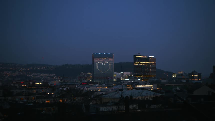Panorama of a metropolis with large buildings at night