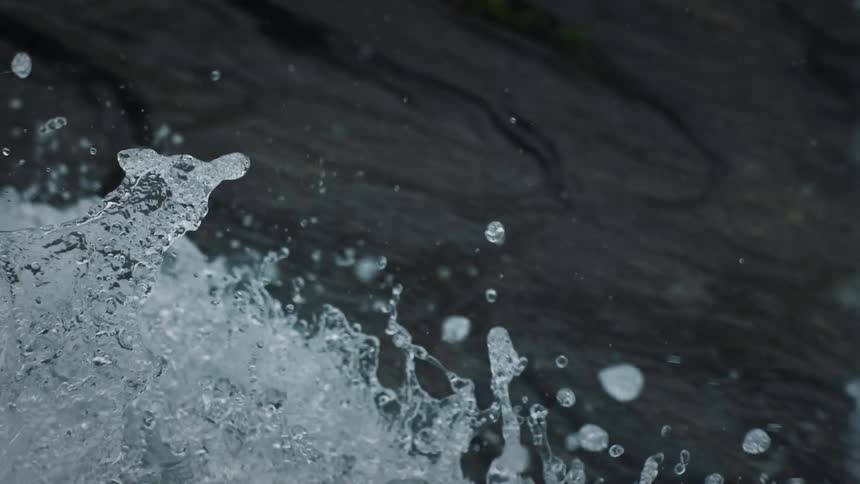 A slow motion shot of ocean waves or water rapids