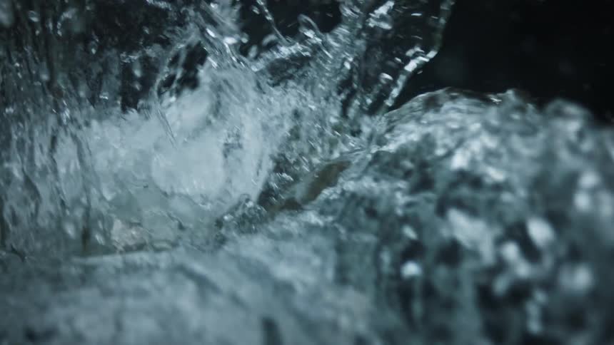 A stream of water flowing and splashing