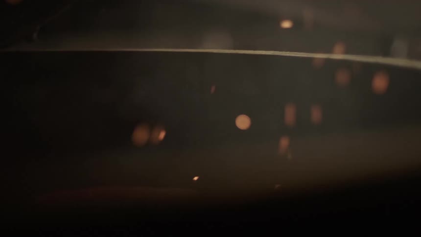 Sparks fly out of a fireplace