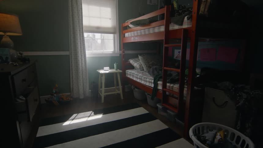 Sunlight streams through a bedroom window