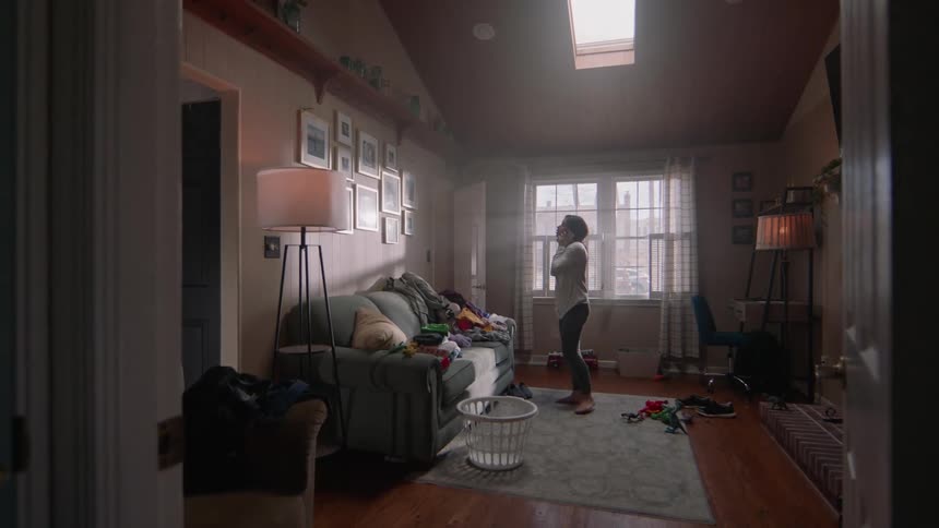 A woman paces as she talks on the phone