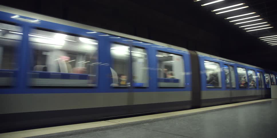 An underground train arrives at a station