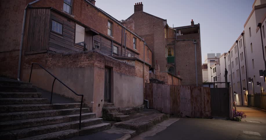 Alley in a residential neighborhood on a cloudless morning