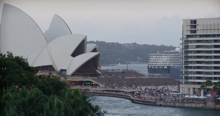 A wide shot of a convention center with a visible crowd