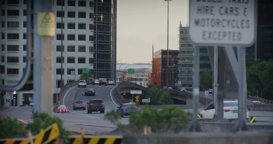 Highway in a metropolis with vehicle traffic during the day