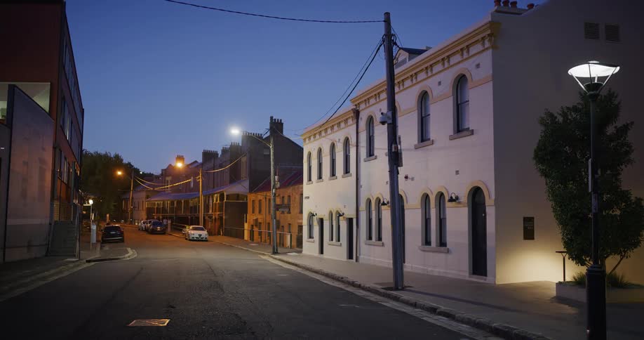 Two people are walking at the end of the road