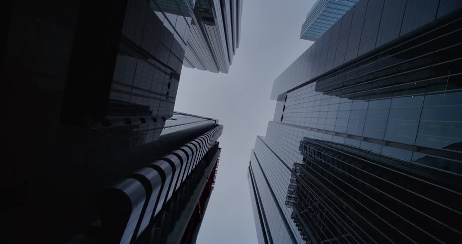 Overcast sky background with towering modern buildings