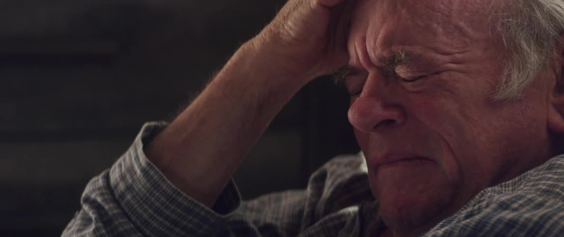 An old man crying and sobbing