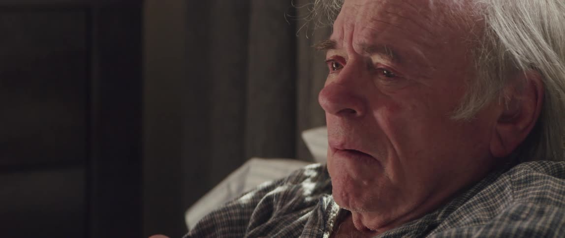 An elderly man reacts negatively during a conversation