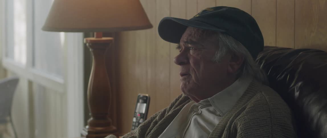 A worried elderly man discusses bad news