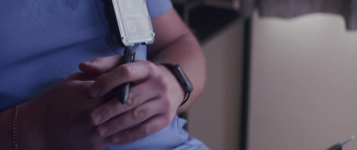 A shot of a clip board in a doctors lap