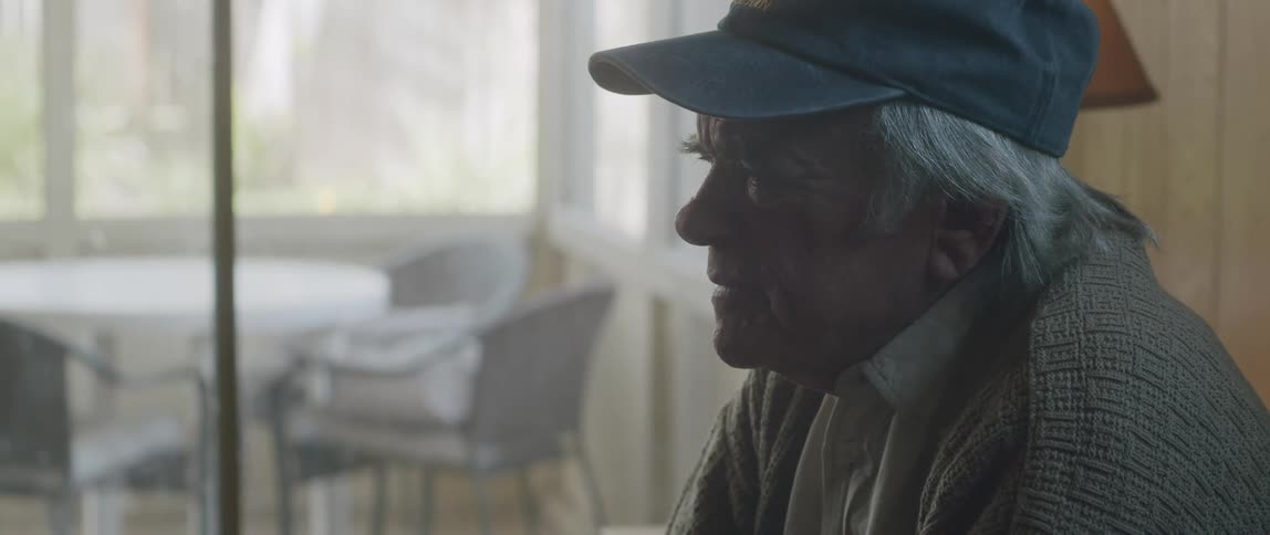 A man discusses something his face showing stress