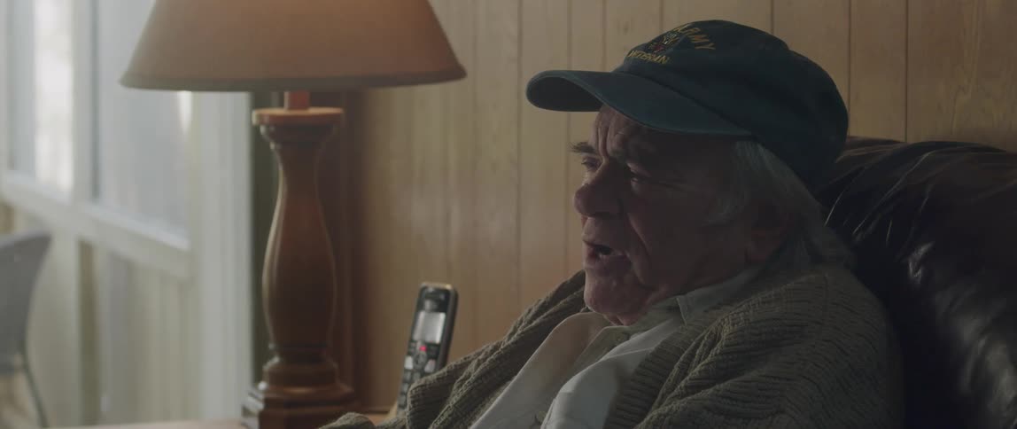 Elderly man crying emotionally while talking