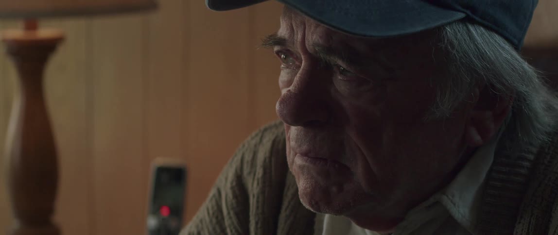 Portrait of a sad elderly man talking and we make the facial expression of denial