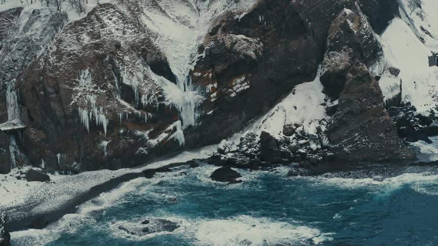 A bay beach covered in ice and snow