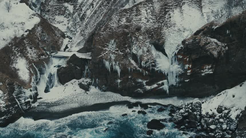 Ocean waves crashing against a rocky shore