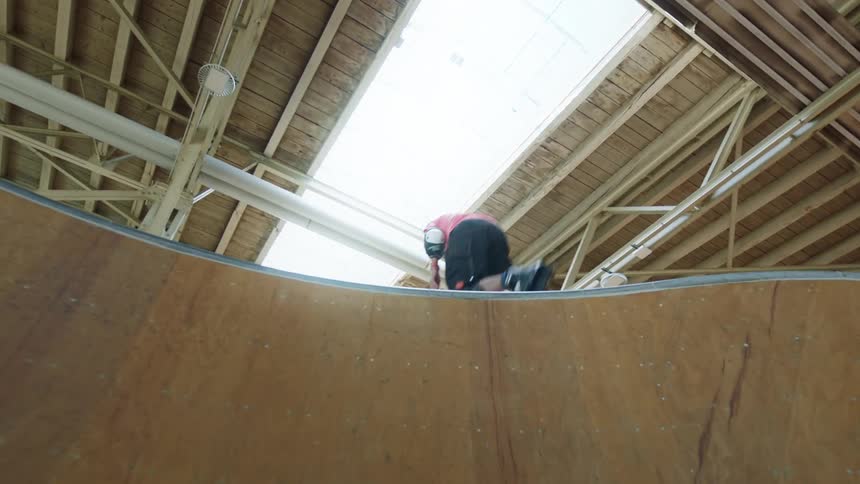 A man rollerblades up the ramp