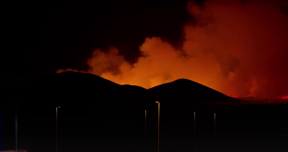 A fire is giving off large amounts of smoke behind mountain