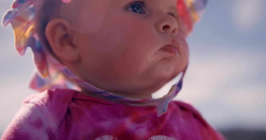 A baby looks into the distance