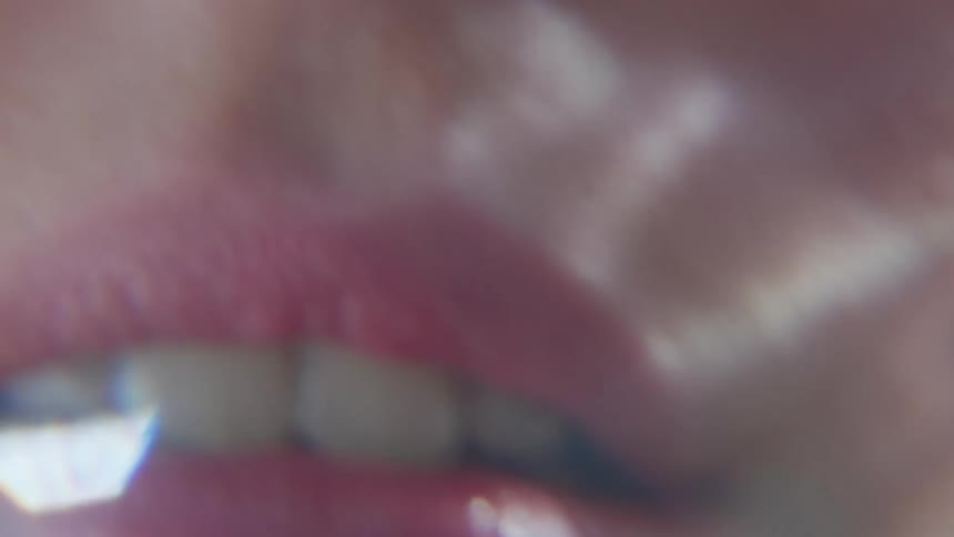 A woman is wearing red lipstick