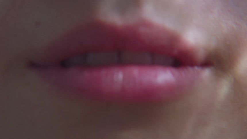 A woman is wearing red lipstick