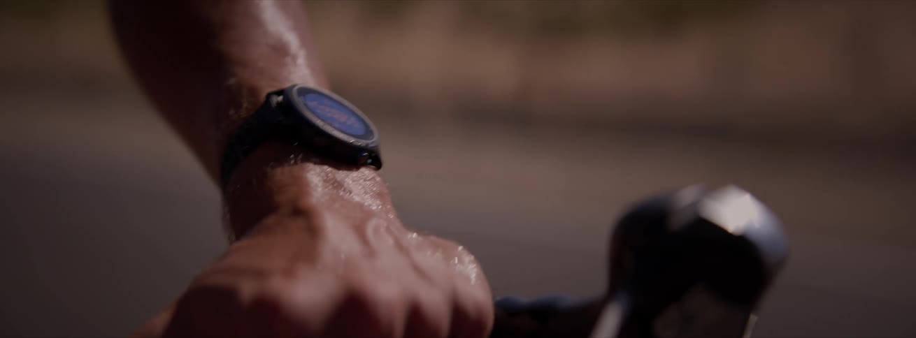Close up of the wristwatch of a sweaty cyclist