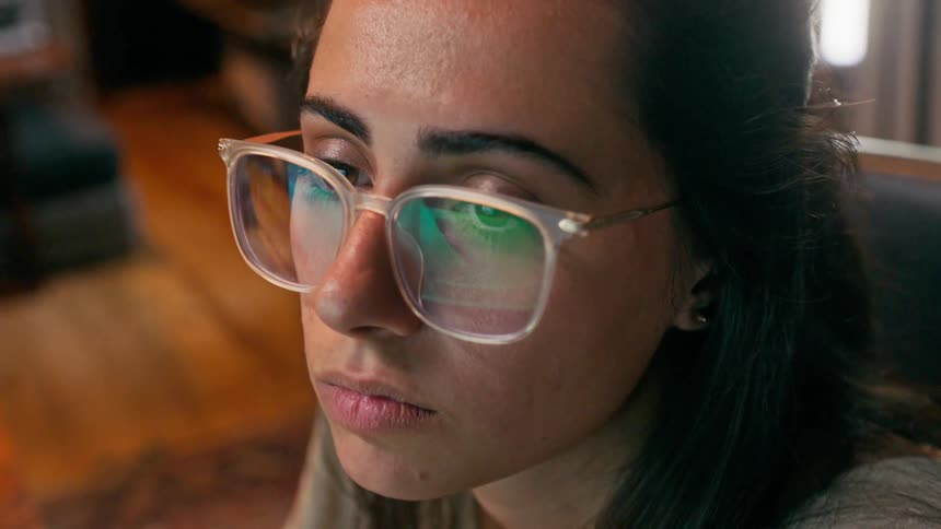 Portrait of a concentrated young woman while wearing her prescription glasses