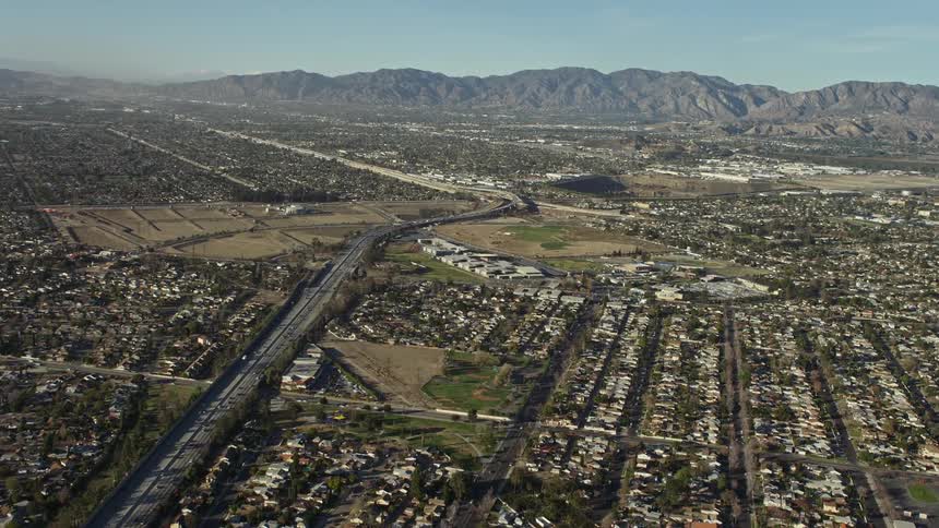 Suburbia at the base of a mountain range on a sunny day