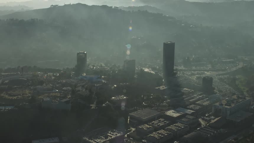 A city covered in a fine fog on a bright day