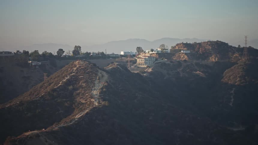Aerial panorama of hills and mountains with buildings in a morning
