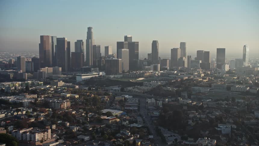 A shot of the los angeles city skyline at dawn