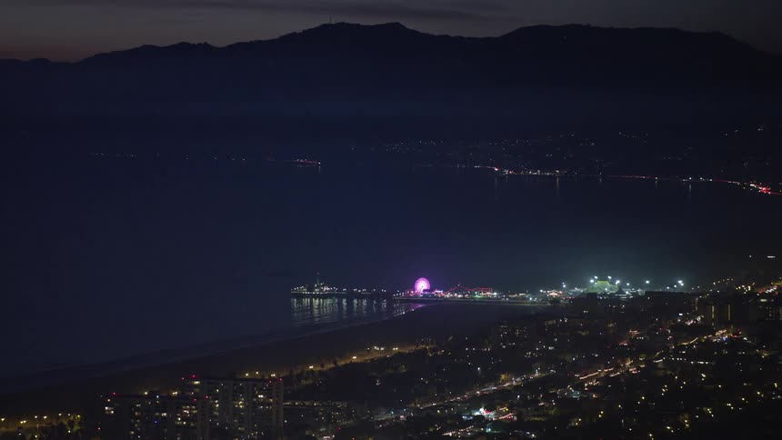 Panorama of an urban city by the sea at dusk