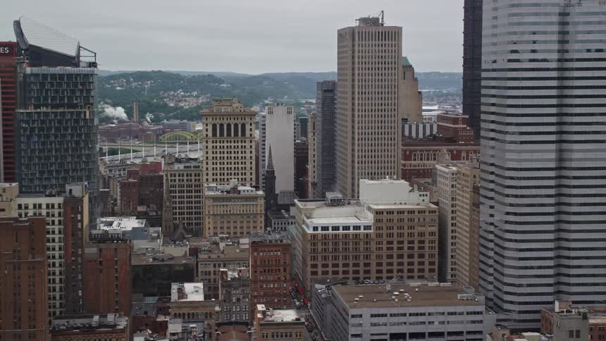 Panorama of modern buildings and skyscrapers in a metropolis on a cloudy day
