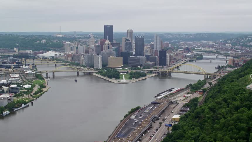 River forks around downtown skyscrapers on a foggy day