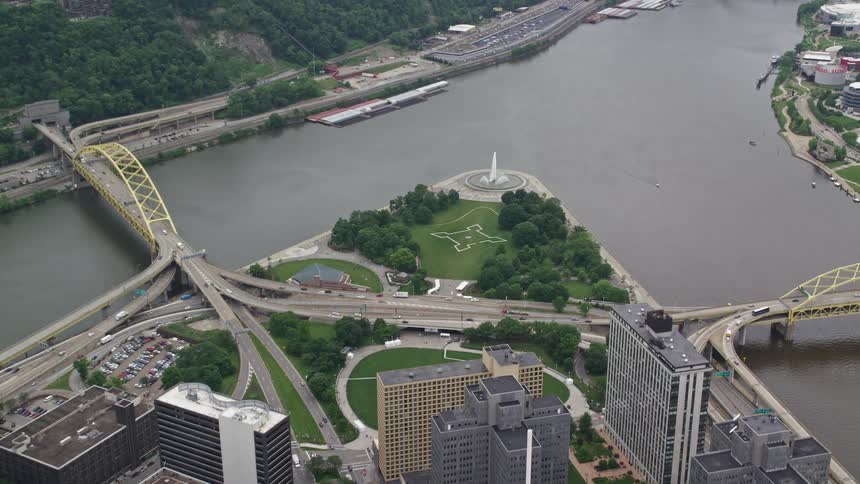 A fountain sits where the city meets the river
