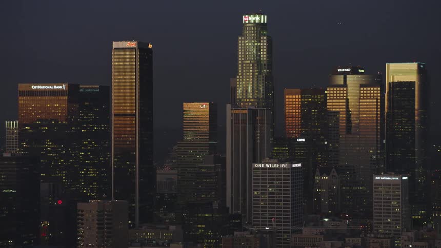 Aerial panorama of a metropolitan city with skyscrapers at dusk