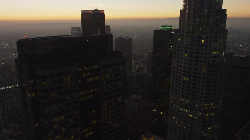 The sun is rising on the city
