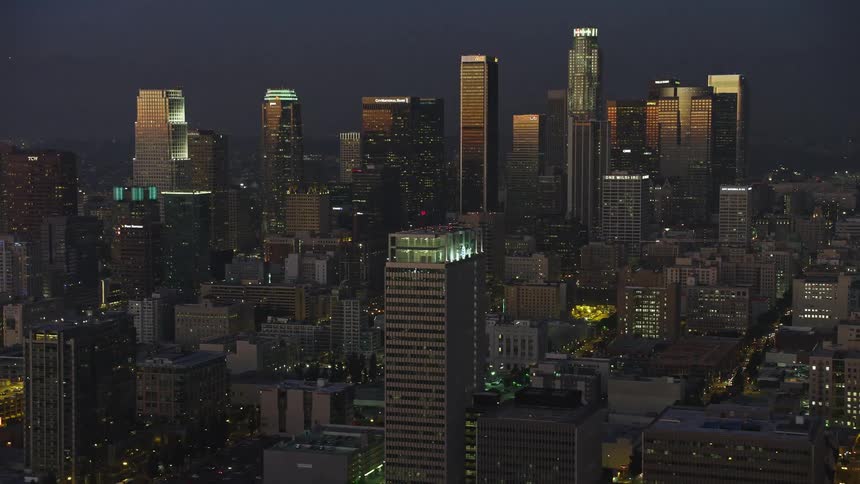 Aerial panorama of a metropolis with skyscrapers at dusk