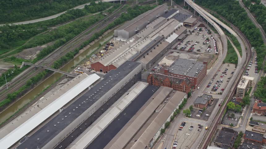 Aerial panorama of a complex with warehouses and surrounding highways