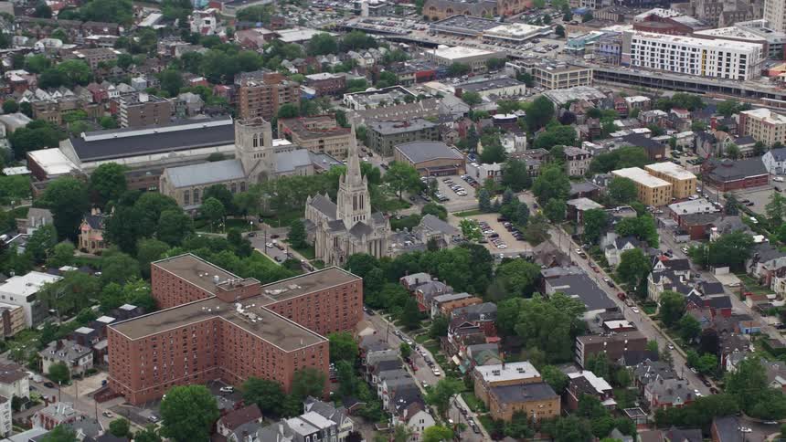 A church surrounded by city buildings