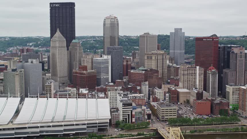 Cars cross the bridge into the big city