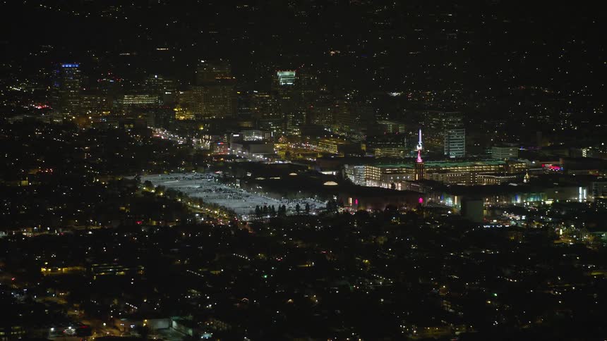 The buildings are lit up at night in the metropolis